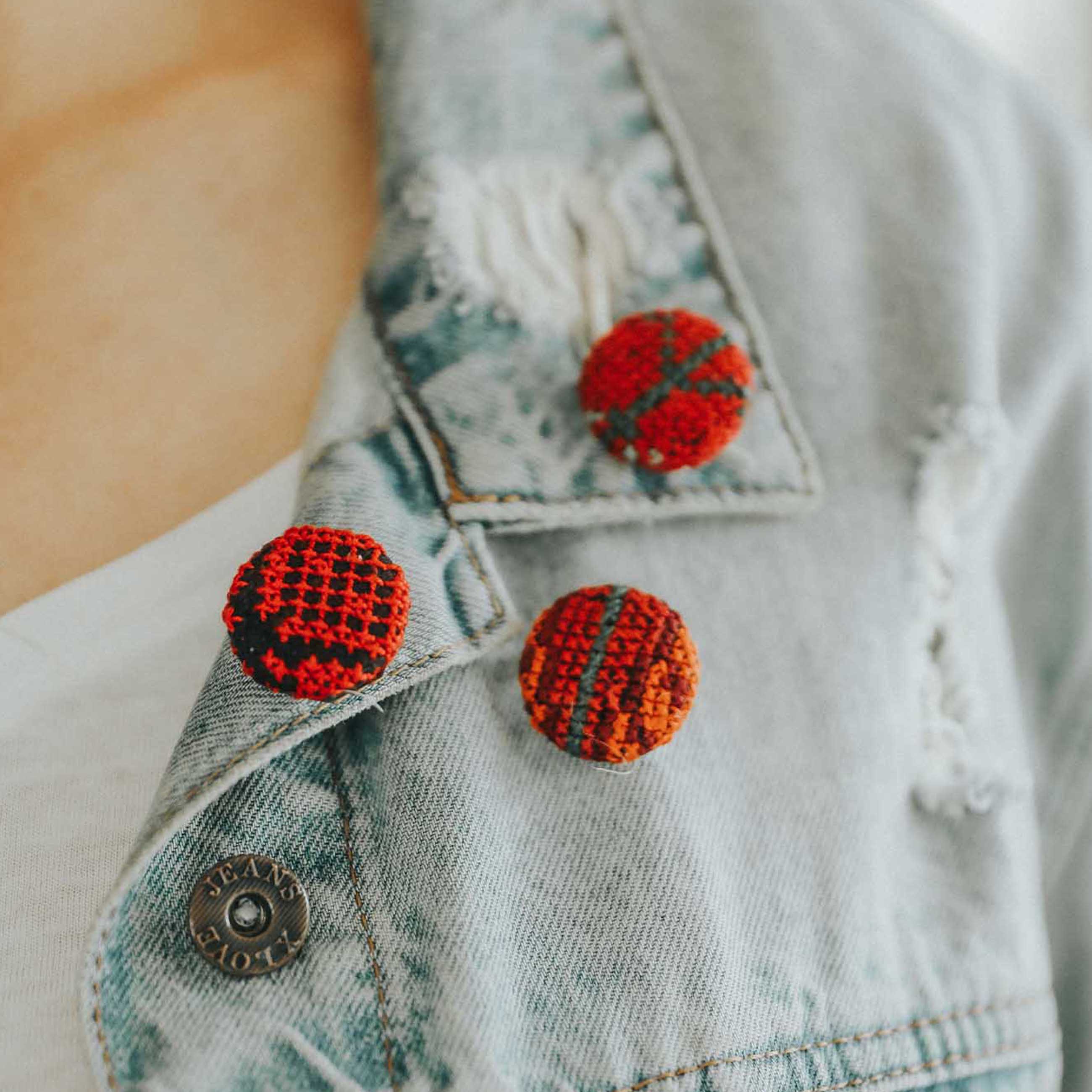 Three Embroidered Buttons